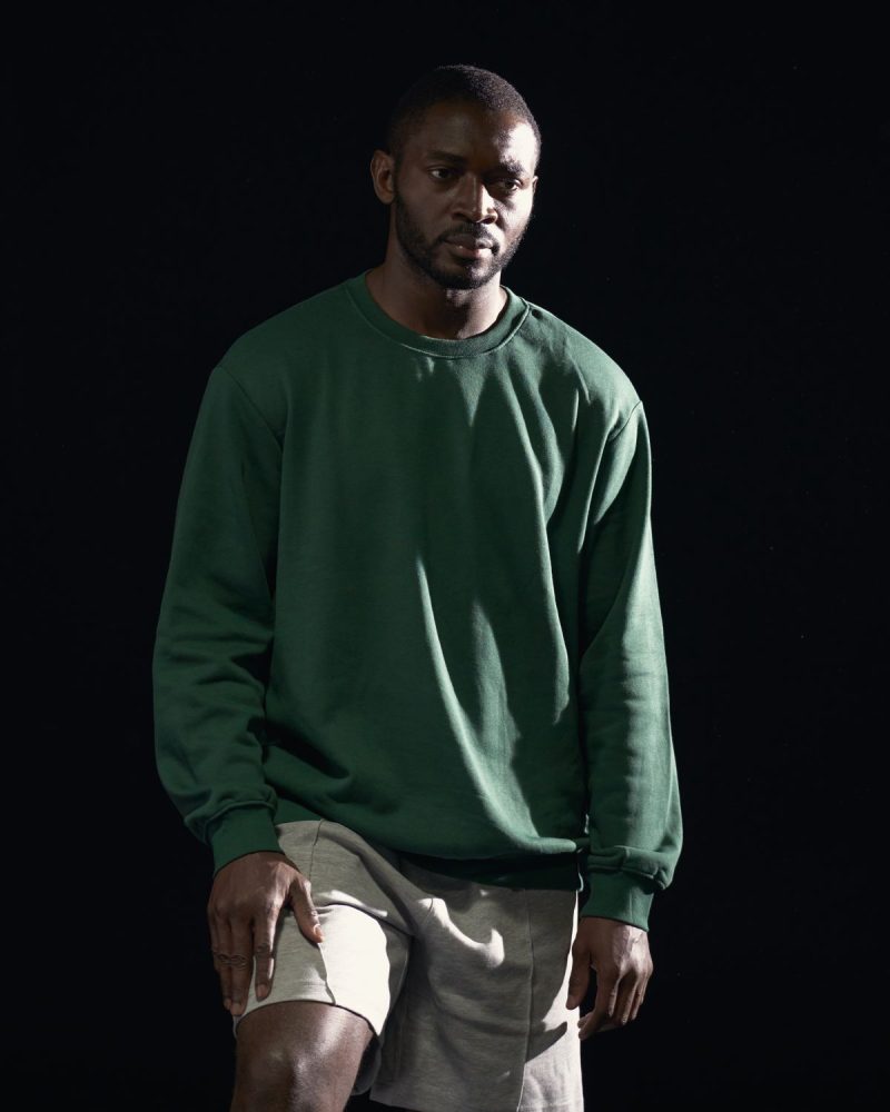 Olive green crewneck sweatshirt, full body studio shot